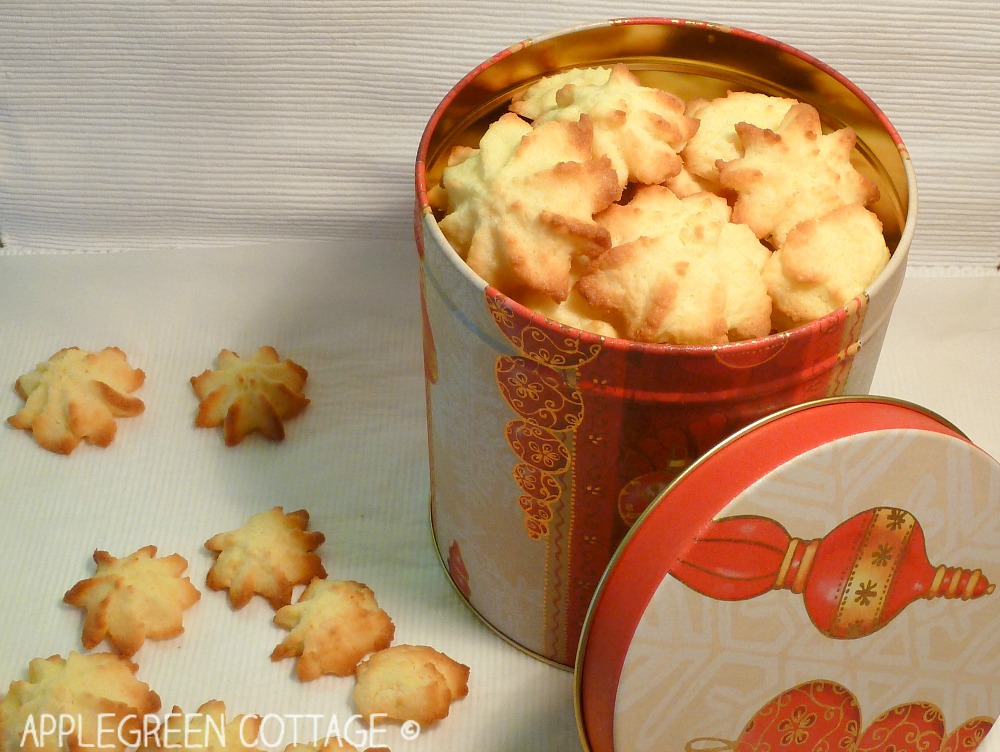 Christmas Coconut cookies from the oven cookie container full with homemade coconut cookies