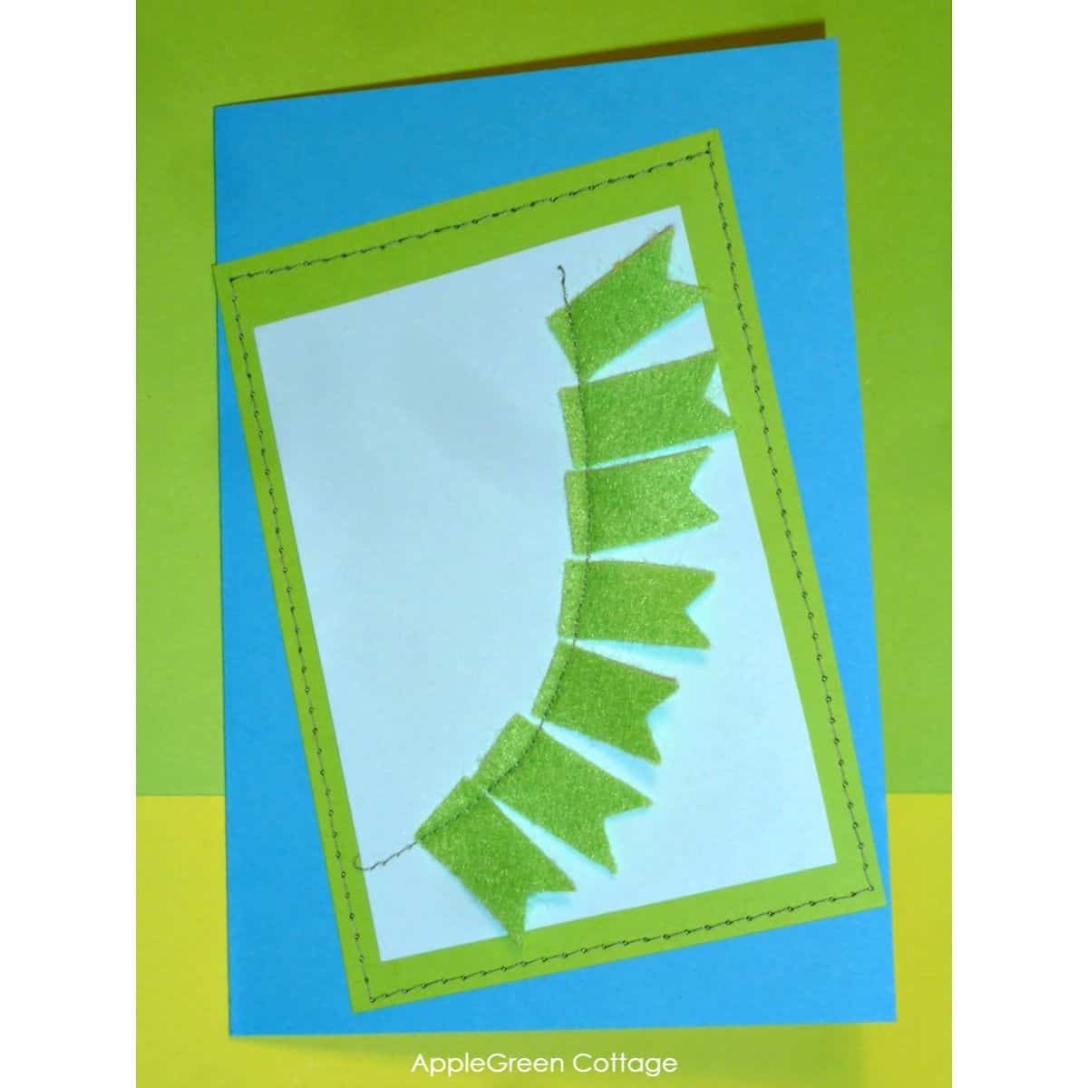 a finished handmade felt and paper birthday card to gift