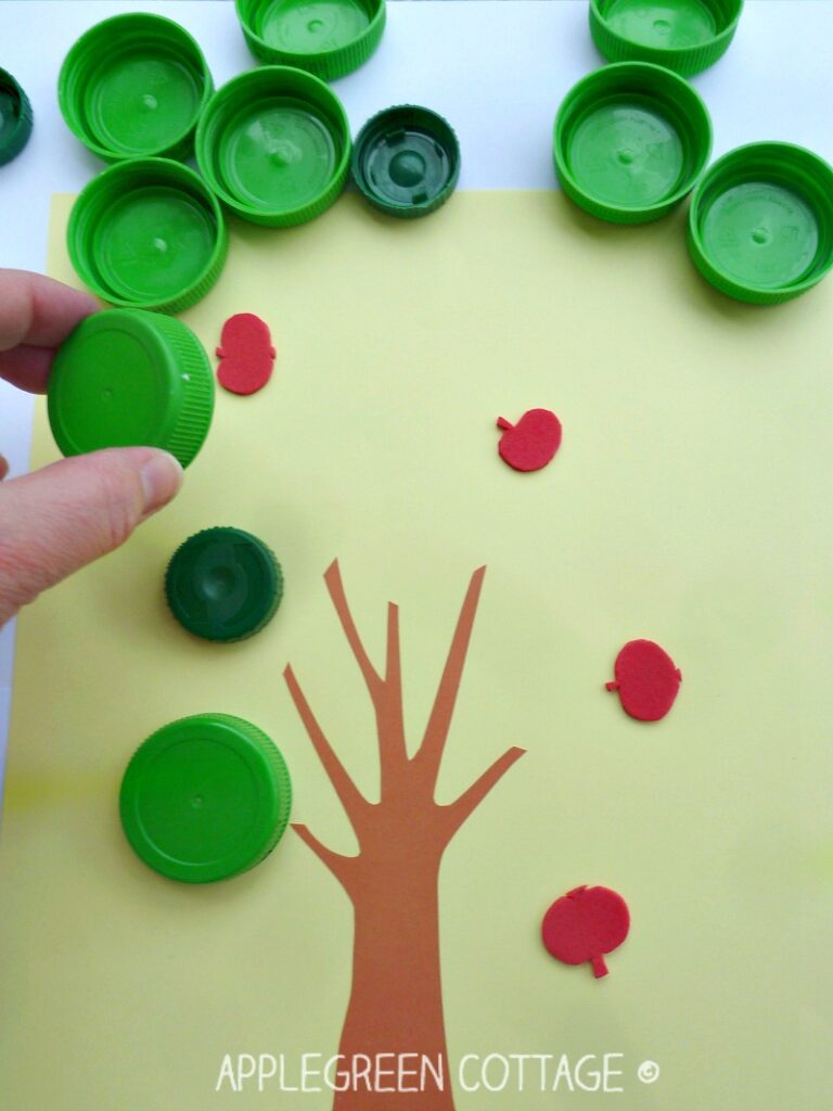 apple hunting activity for kids using plastic bottle caps