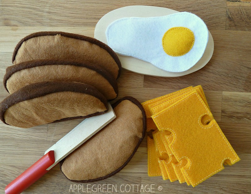 a table setting with diy felt play food