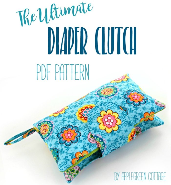 handmade diaper clutch with a handle in blue patterned fabric