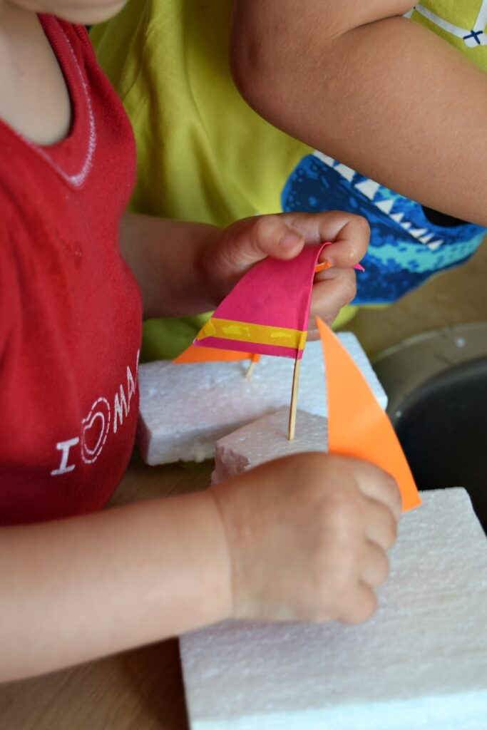 How to make easy DIY sailboats out of styrofoam packaging. A great water play idea for the summer your kids will love! 