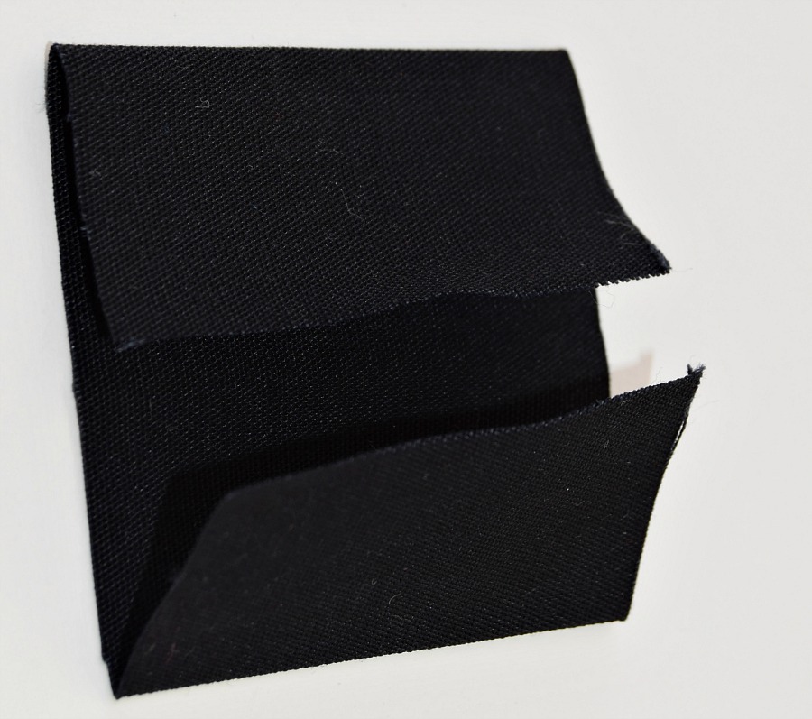 a piece of black fabric with the ends folded in