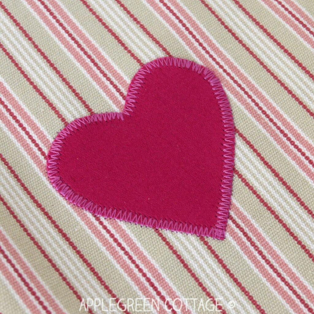 finished pink heart applique on fabric