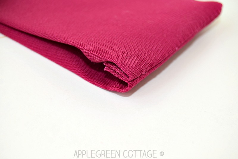 corner sewing detail on pink fabric