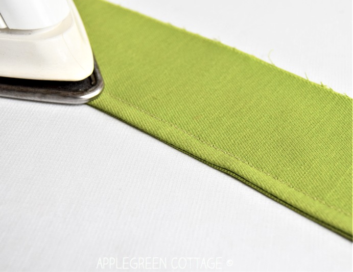 iron and green fabric with finished seam