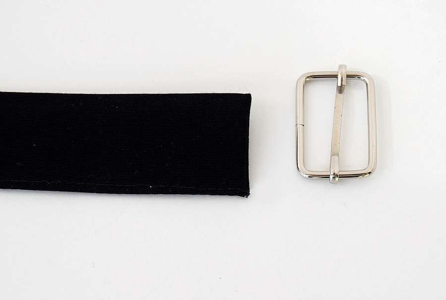 a finished bag strap on the left and a bag slider piece on the right