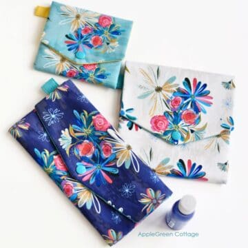 beautiful flat snap pouches with a flap, sewn with blue floral fabric.