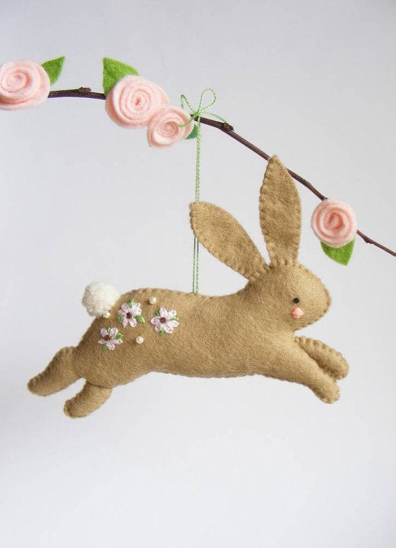 diy felt bunny hanging from a branch