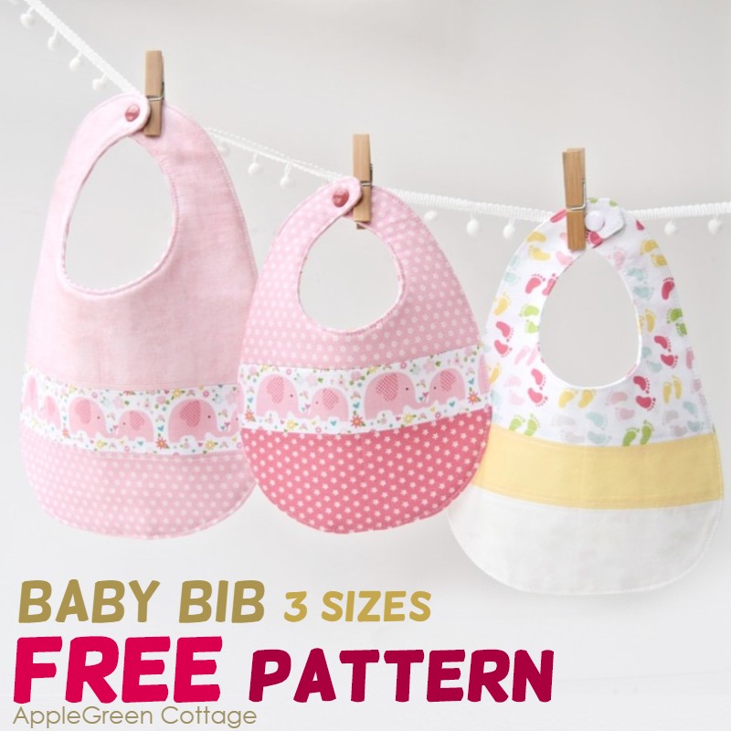 three beautiful finished baby bibs hanging on a washcloth