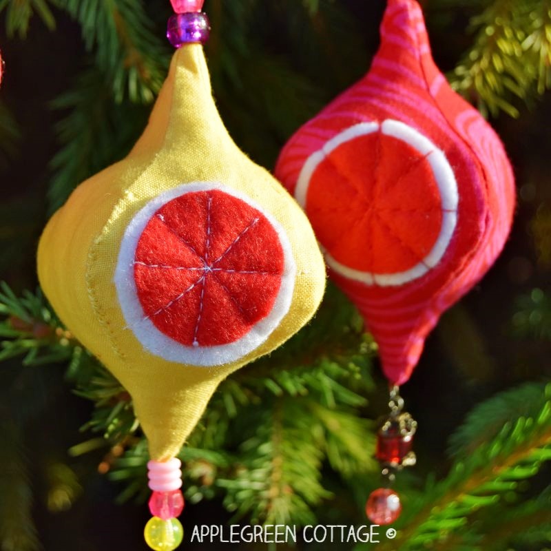 diy yellow and red baubles hanging from a fir tree