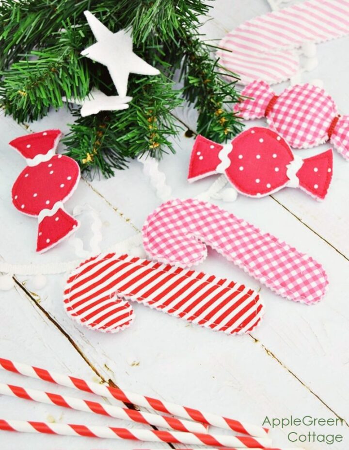 Felt candy and candy cane ornaments in bright prints, stitched with pinking edges for a beginner sewing project.