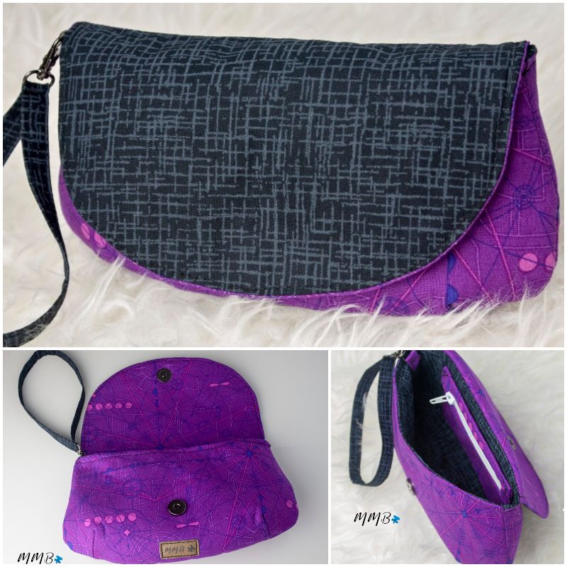 a finished fabric clutch purse with modern geometric print in black and purple cotton