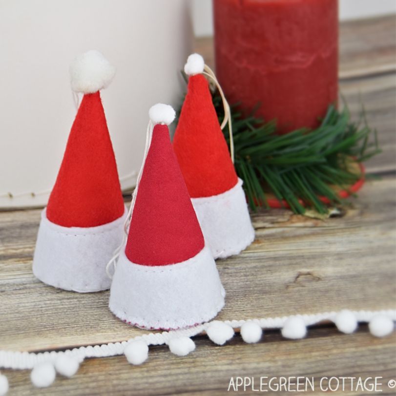 three finished santa hat ronaments used as holiday as table topper decor