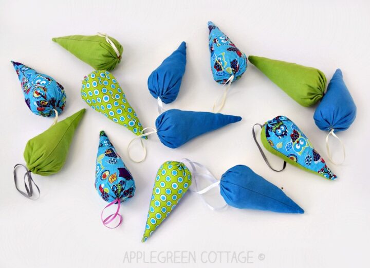 little cone-shaped fabric ornaments in green and blue for a Christmas tree