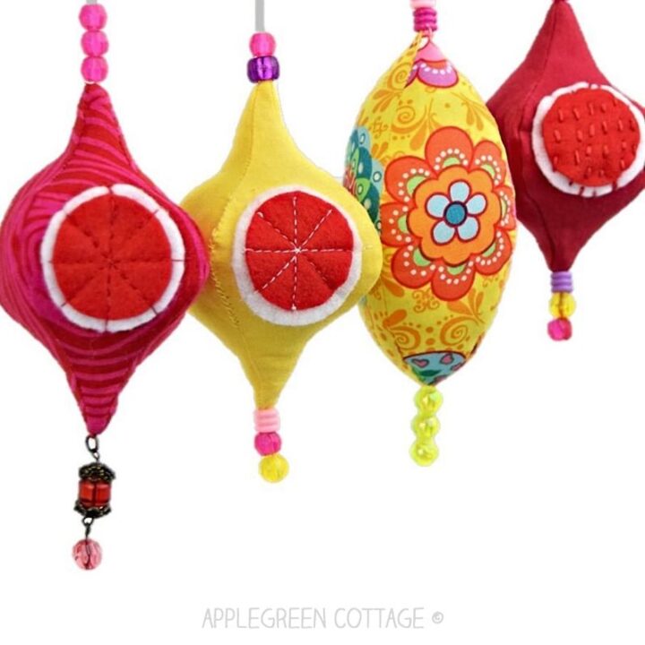 Colorful quilted finial ornaments with felt circles and beads, showing stuffed construction and decorative stitching.
