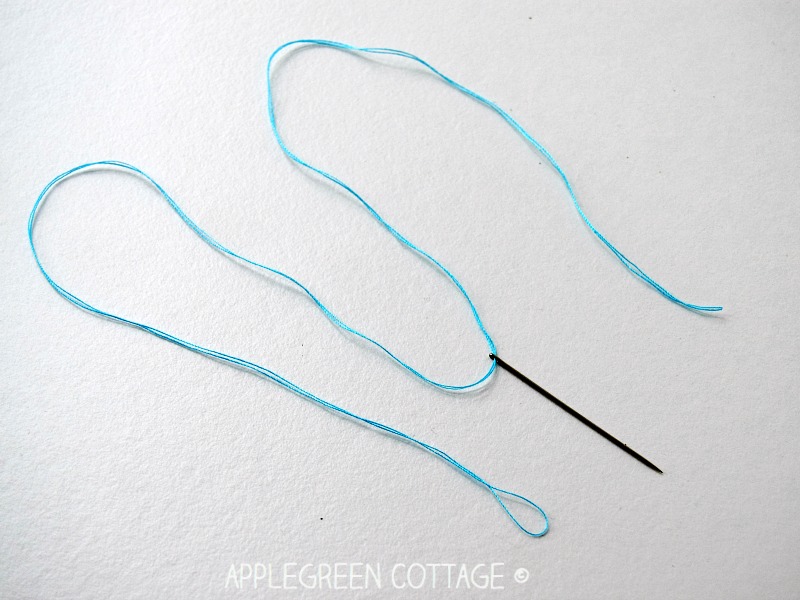 threaded needle with thread for sewing