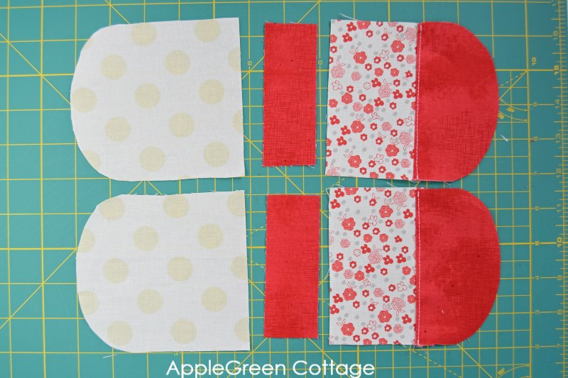 fabric pieces for a round fabric drawstring pouch cut on a cutting mat and ready for sewing