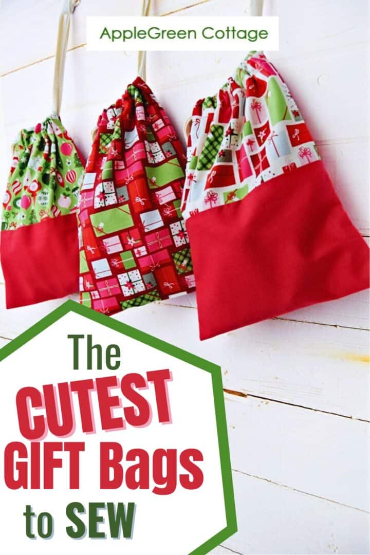 three handmade gift bags sewm with christmas prints, hanging from the mantel and filled with holiday presents