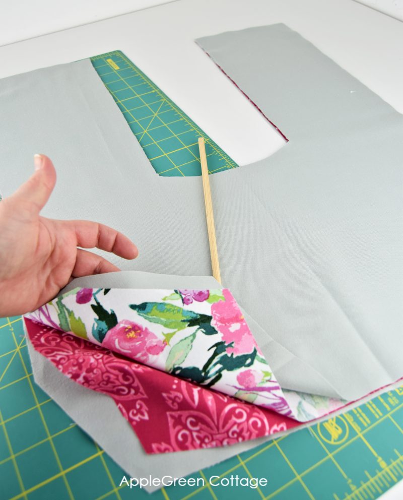 stacking pieces of fabric to sew a heating pad for back