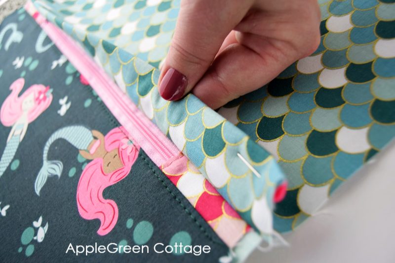 zipper pocket in a drawstring backpack