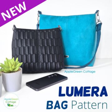 Two beautiful handmade bags on a white table, one is black faux leather bag and the other is a regular size teal faux suede bag with a shoulder strap.