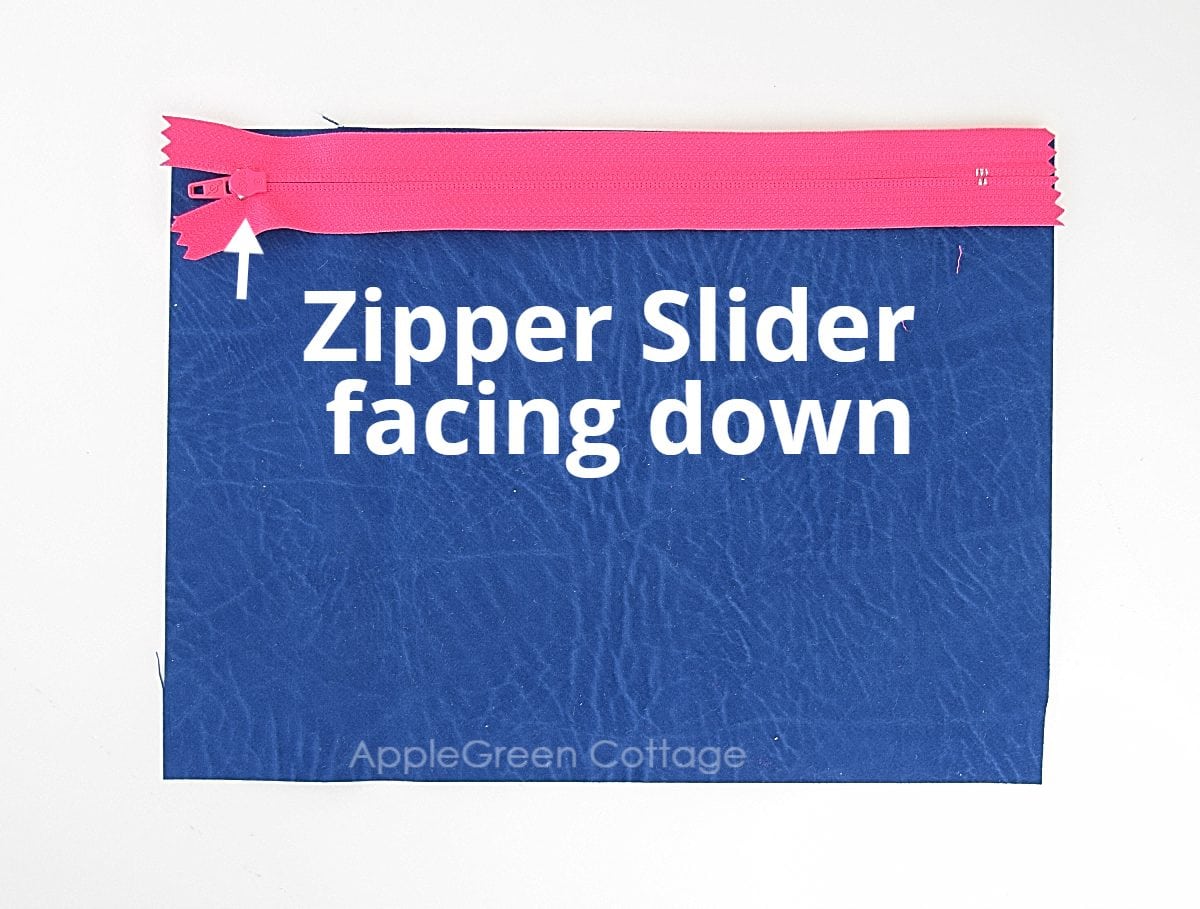 sewing zipper to blue fabric