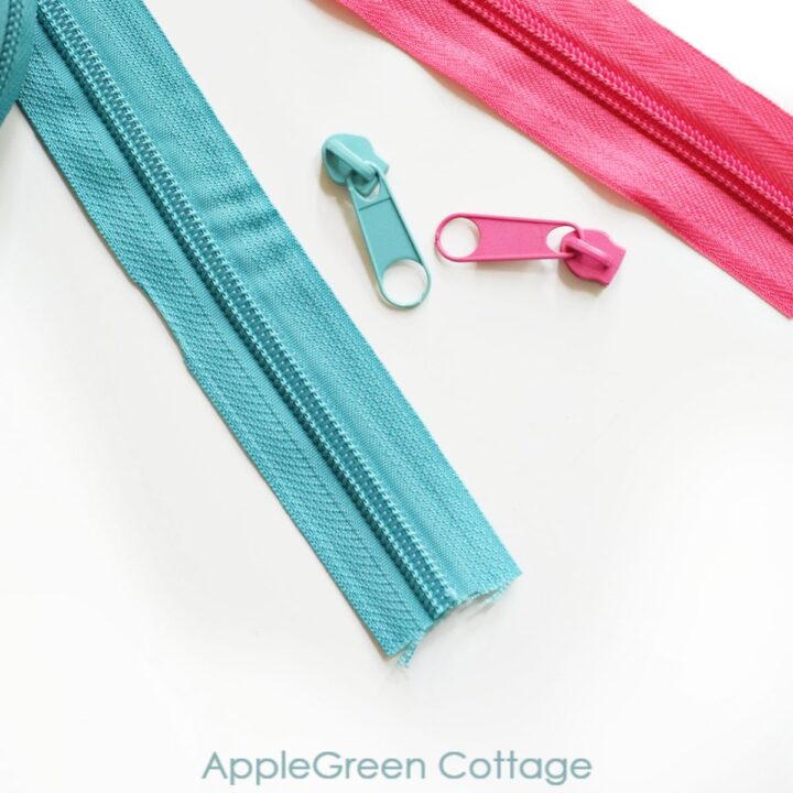 installing a blue zipper head on a blue zipper tape and a pink zipper tape with a pink zipper slider