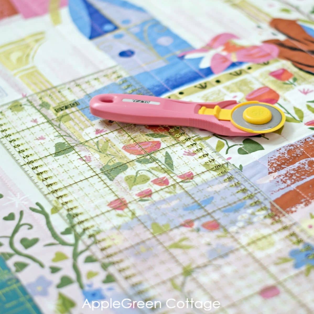 quilted fabric panel and squared up with a pink rotary cutter and quilting ruler