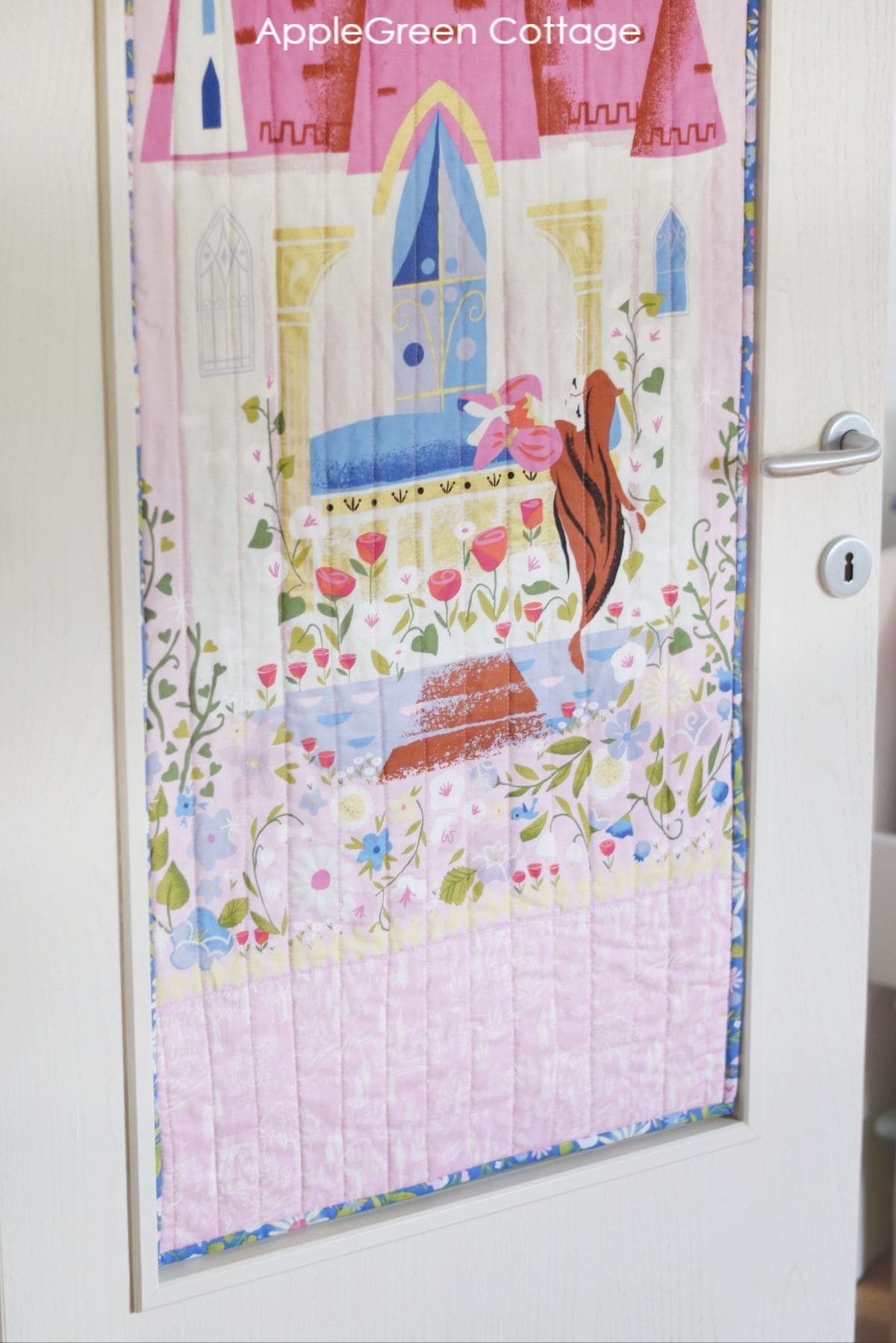 a finished panel quilt with binding in blue floral print 