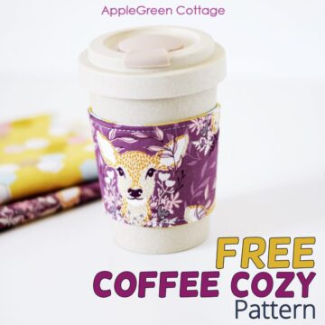 a bamboo cup with a sip cover, wrapped in a handmade fabric coffee cup cozy