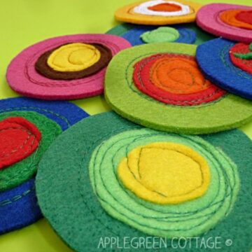 finished felt coasters in vivid colors of several shades and felt thicknesses.