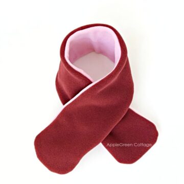 DIY fleece scarf with a soft maroon and pink color combination, featuring a cozy and stylish design perfect for kids and toddlers.