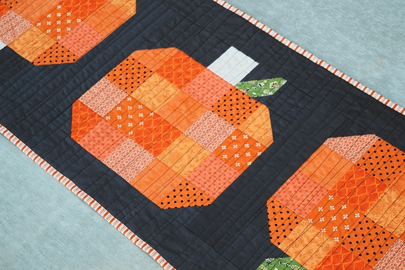 orange and black pumpkin table runner