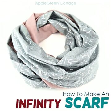 a finished knit jersey infinity scarf softly wrapped on a white surface.