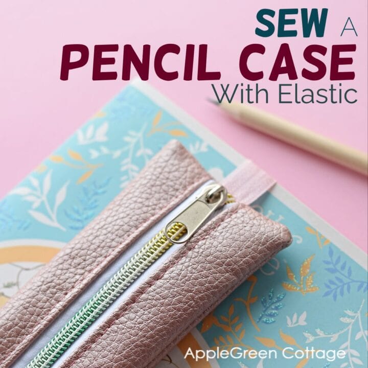 pink diy pencil case attached to a journal with an elastic band