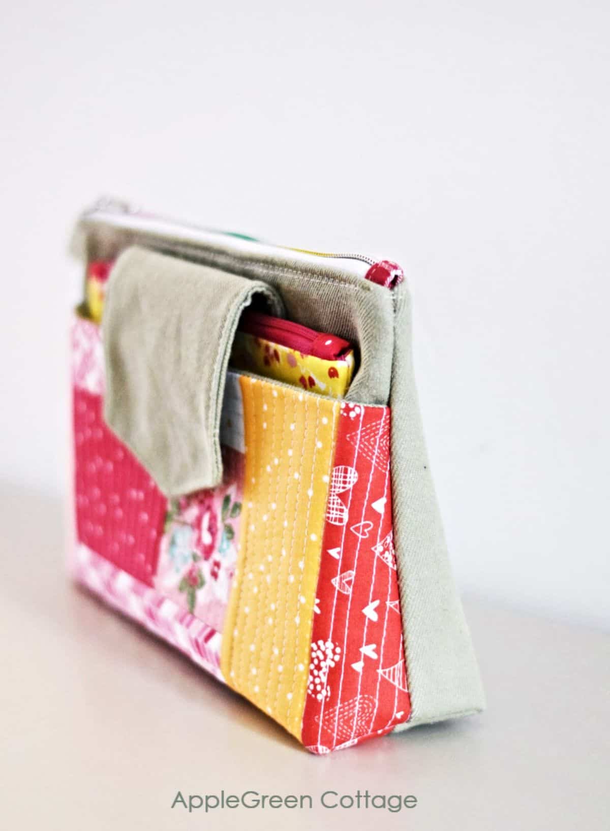 quilted large zipper pouch in bright red and yellow cotton prints