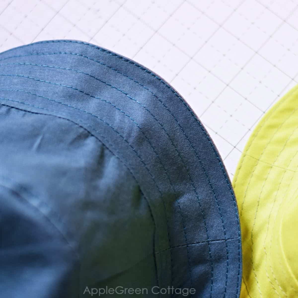 a hat brim topstitching detail shown on two hats