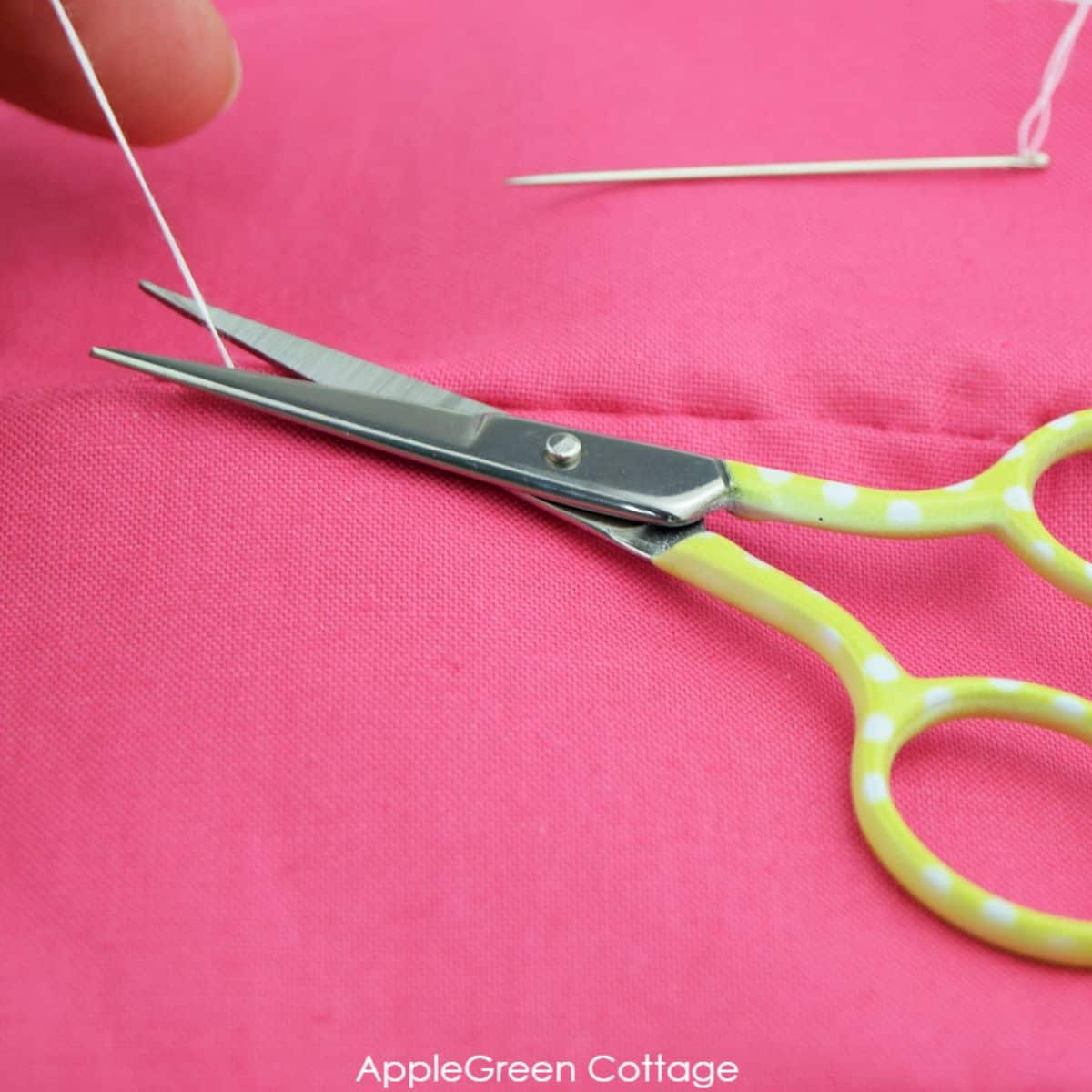 snipping of thread on a finished ladder stitching