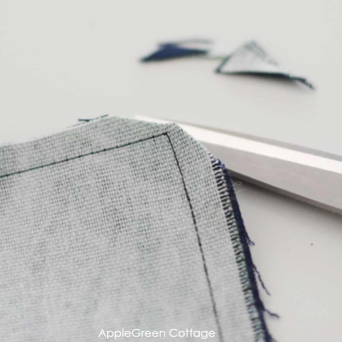 fabric on the table runner corners trimmed after sewing