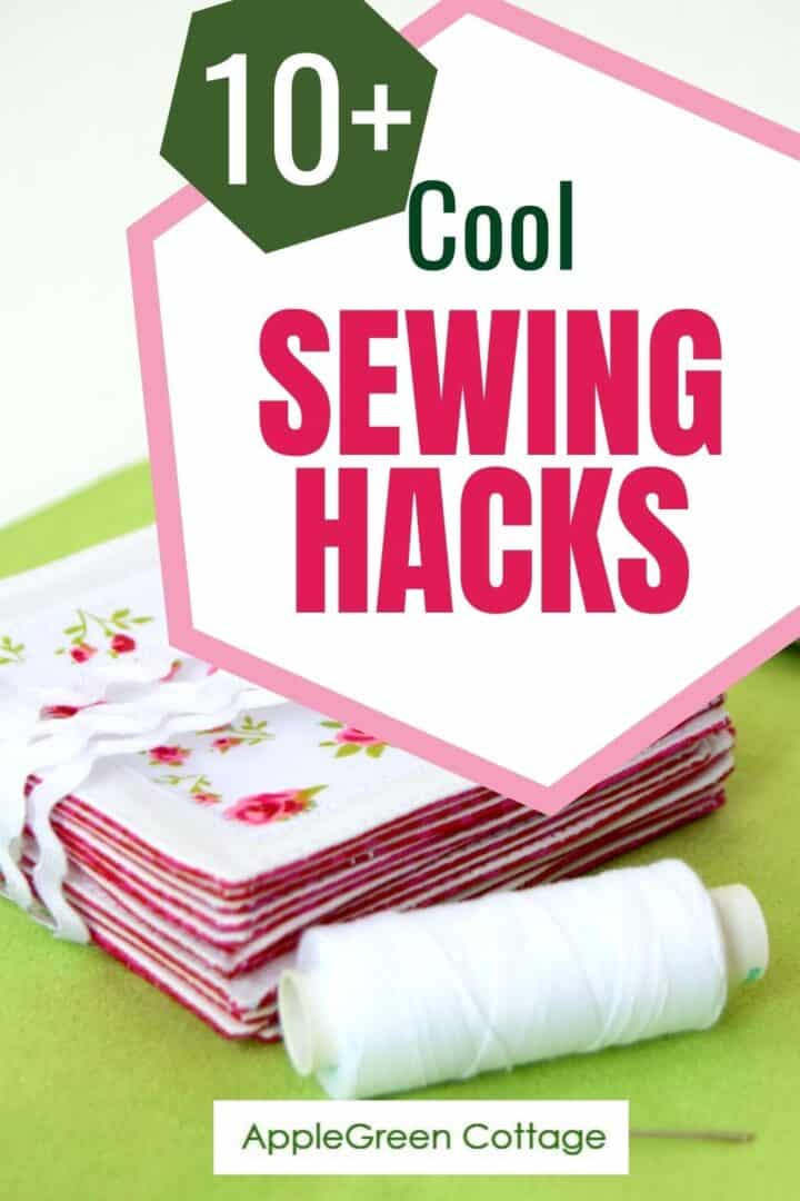 sewing thread spools and a stack of finished items sewn and bundled as a gift, next to a few sewing tools