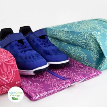three finished fabric shoe bags sewin with an applegreencottage sewing pattern.