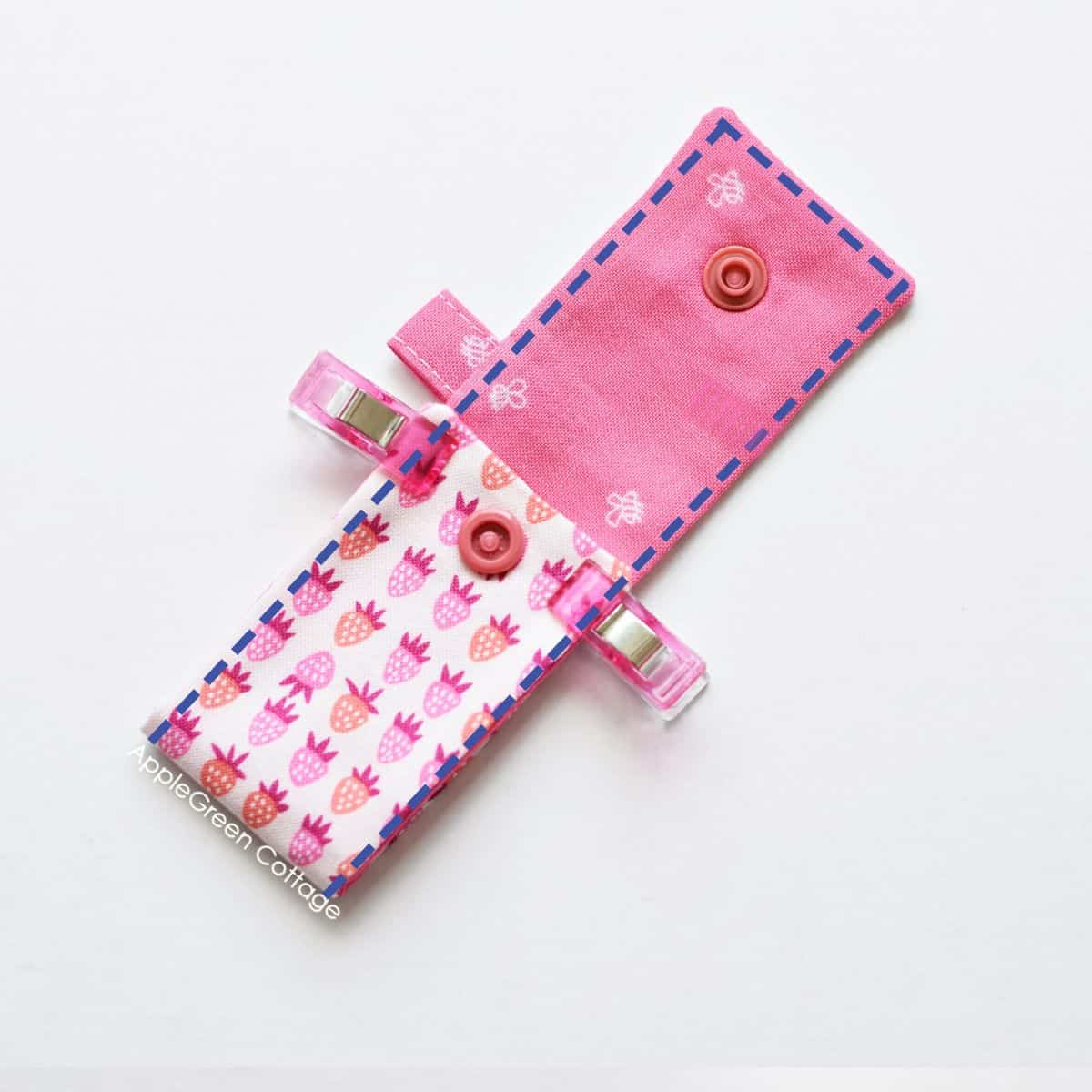 semi finished pink chapstick holder, with sewing clips holding the layers together