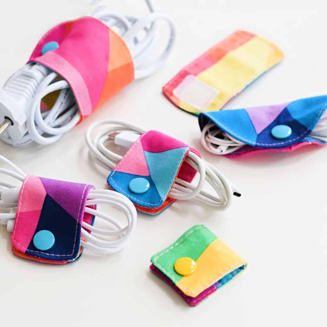 sewn fabric cord keepers holding phone charger cables together