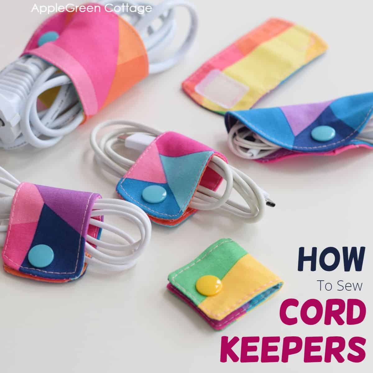 finished fabric cord keepers to wrap around phone charger cables, sewn with a free cord holder pattern