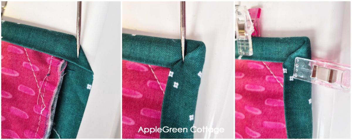 A strip of teal quilt binding being folded around a quilt corner and attached to the quilt.