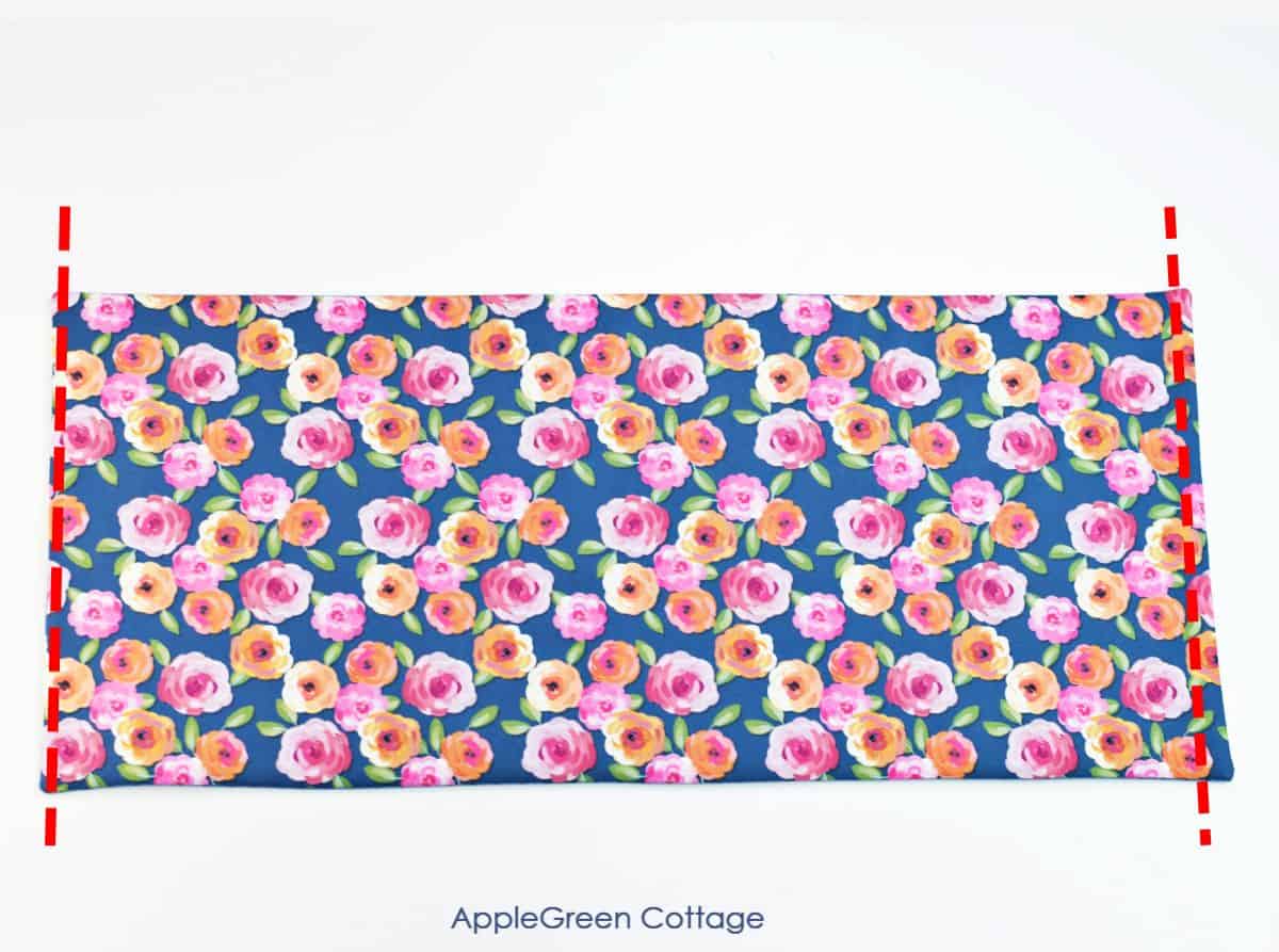 a piece of floral fabric on a table to be sewn into a simpel bag