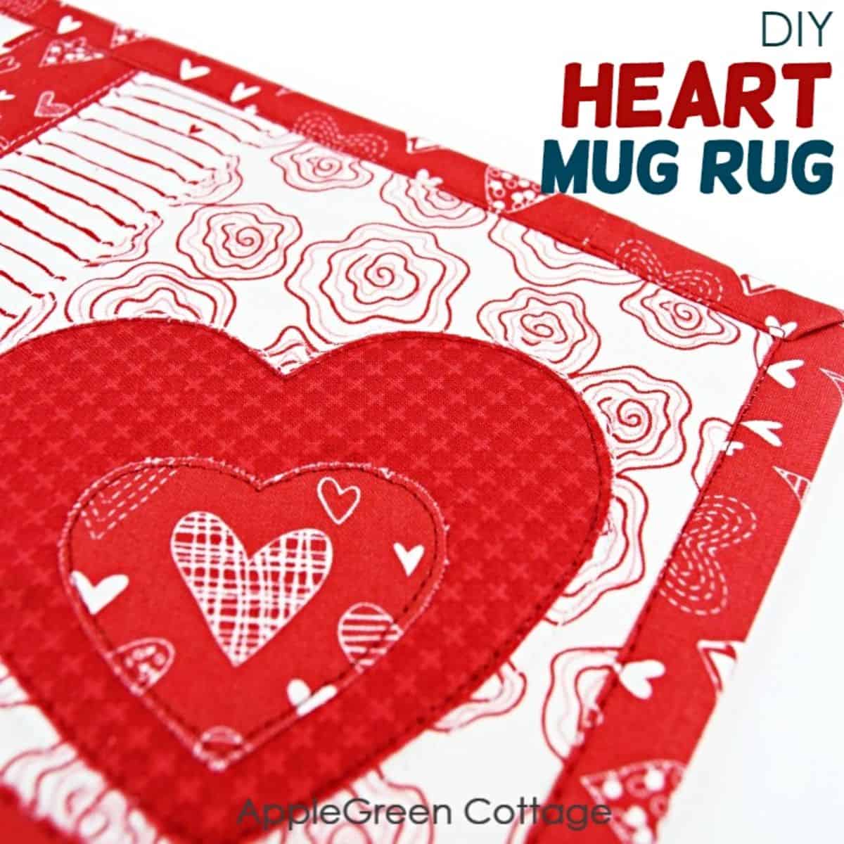 a finished, handamde mug rug sewn with red and white fabric with a heart shaped applique