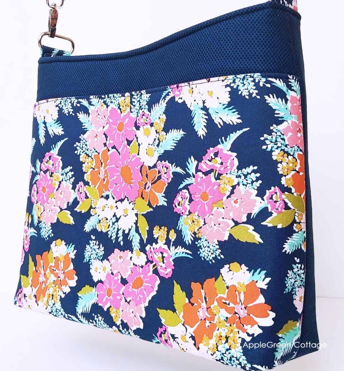 back of a handbag in blue and designer floral cotton print, backed by foam interfacing 