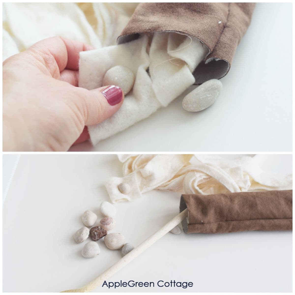 a hand holding a pebble tucked into a piece of cotton batting to insert as filling into a draft stropper